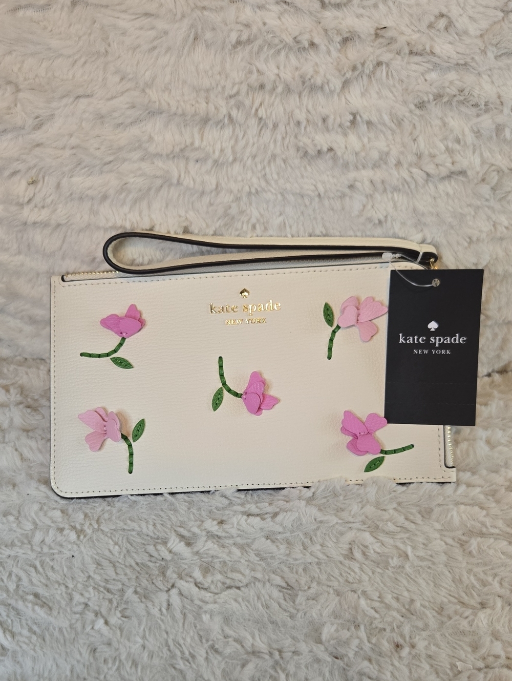 kate spade Cream Wristlet with Pink Floral Appliqués and Green Stems